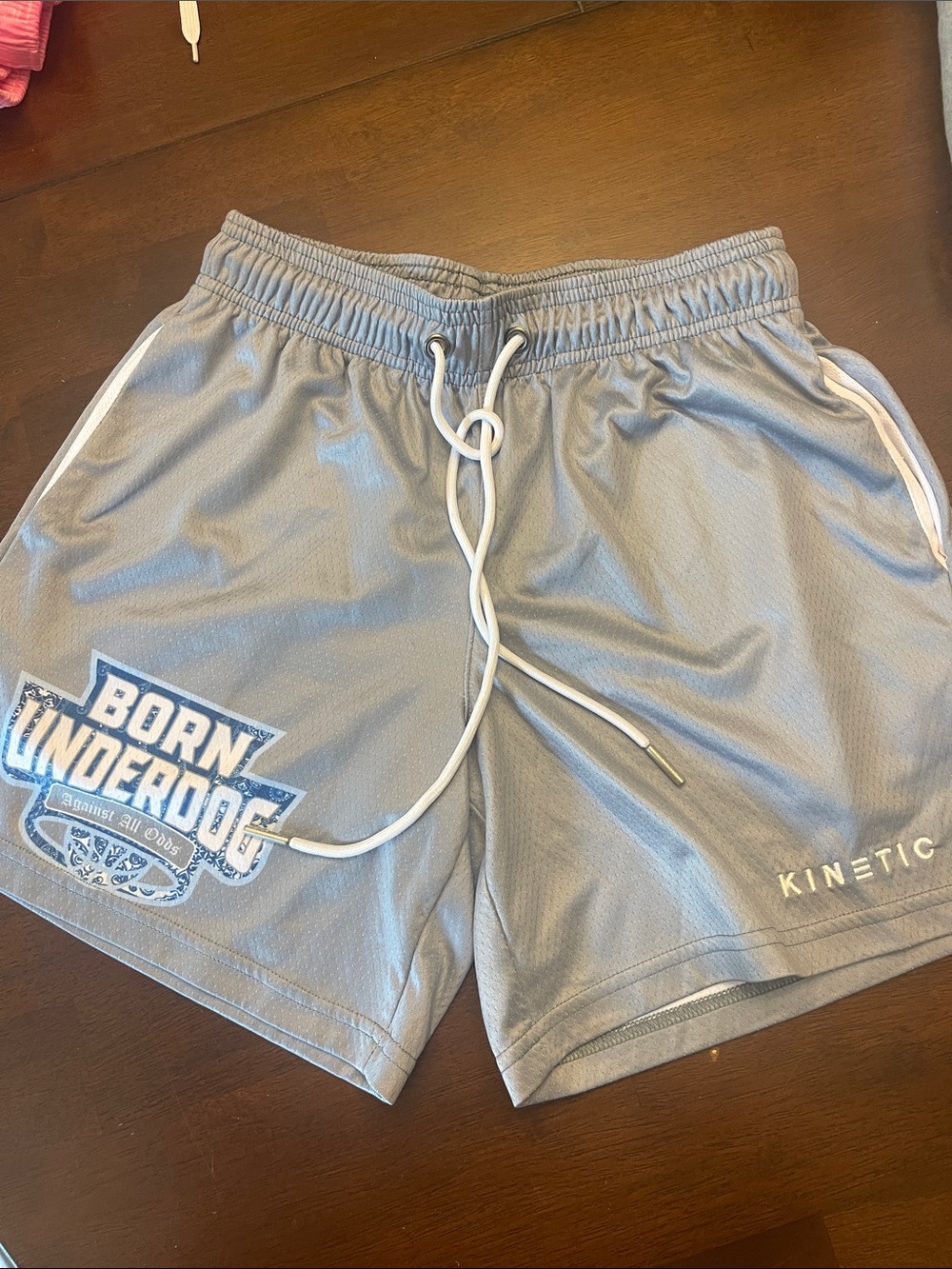 Kinetic Men’s Light Gray Athletic Shorts with Born Underdog Graphic